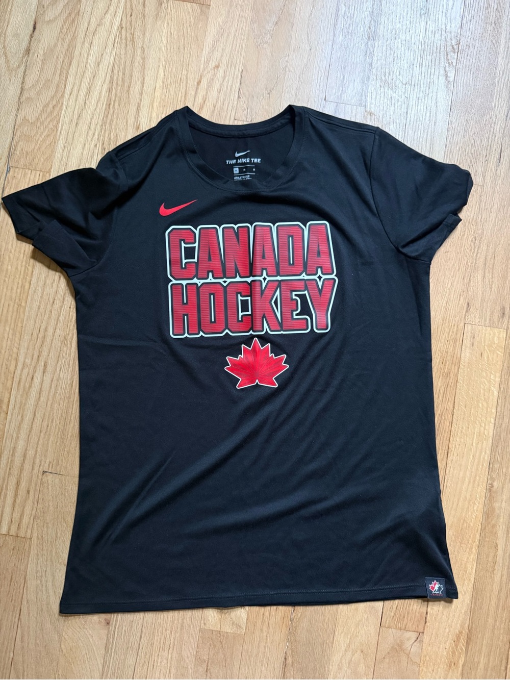 Nike Women’s Black DRI fitCanada Hockey Tee with Red Logo | size M